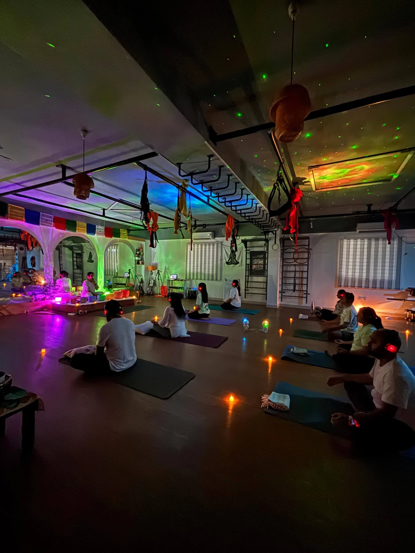 Immersive Sound Healing event with galaxy ceiling lights candles and headphones at Yoga With Jigisha Bangalore